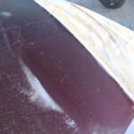 Before and after photographs of a damaged Porsche that was repaired by Elite Paint & Body Shop in West Palm Beach, Florida.